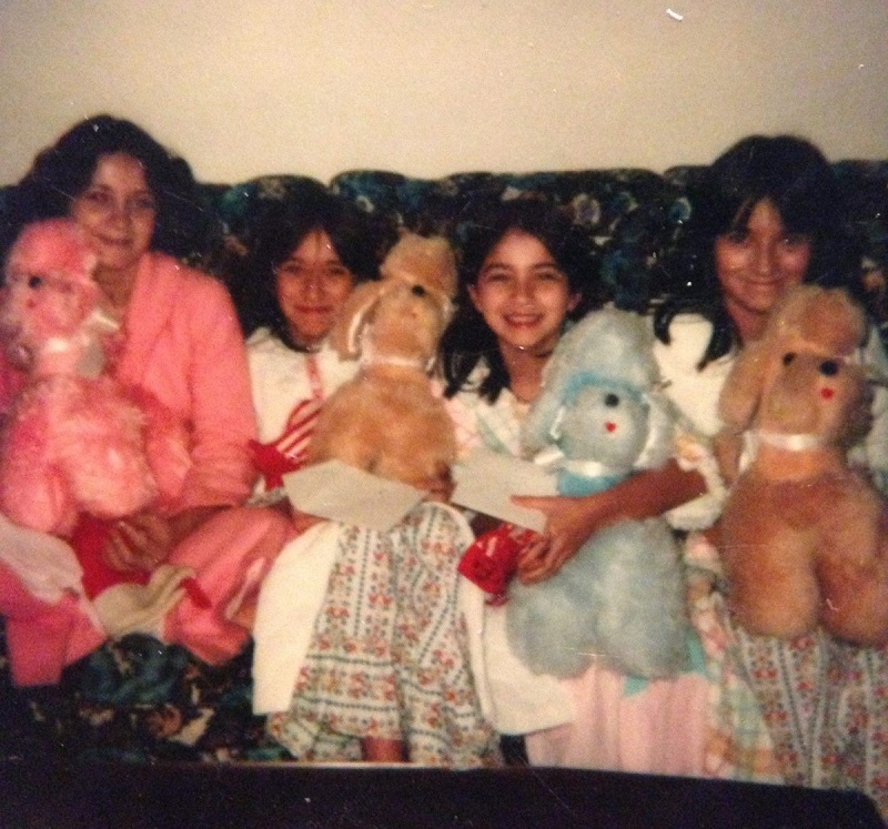 Christmas morning on the couch the year we got our stuffed poodles. Julie Fillinger and sisters