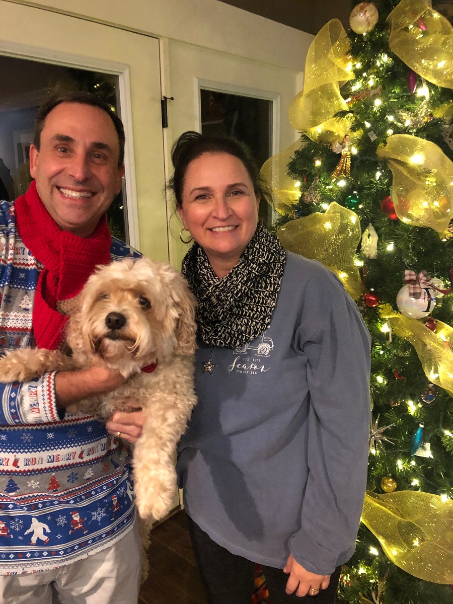 Eric and Julie Fillinger with our dog Toby by the Christmas tree