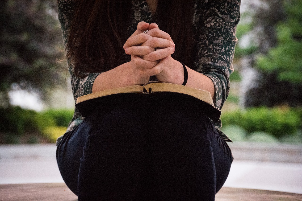 Woman praying God's Word