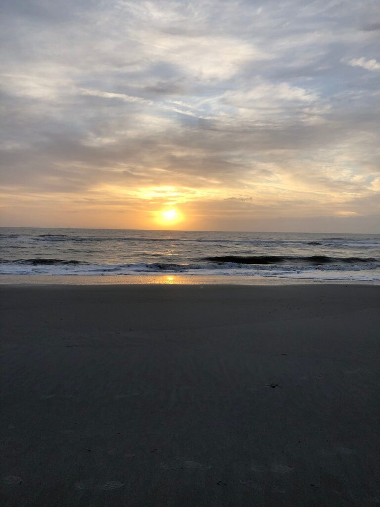 sun peaking through the clouds
