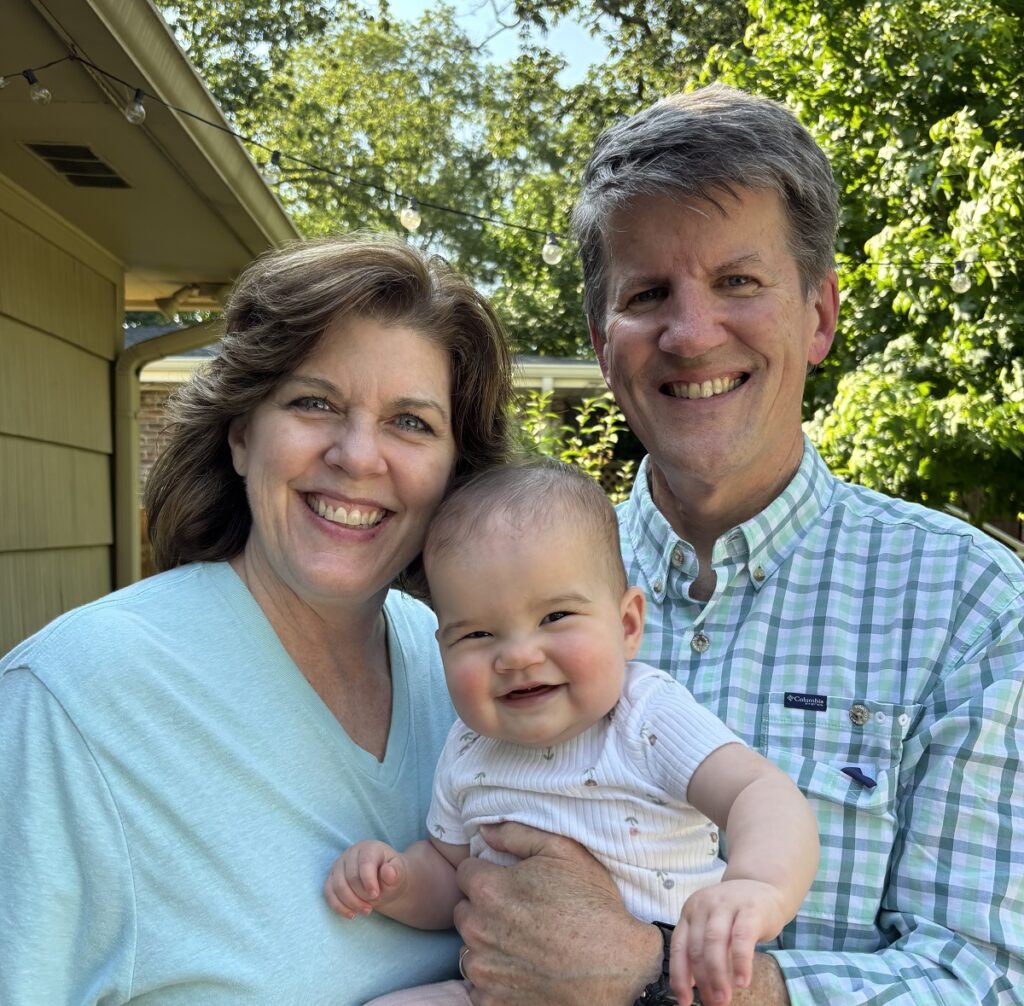 Kim Johnson and Joe Johnson, MD with their granddaughter